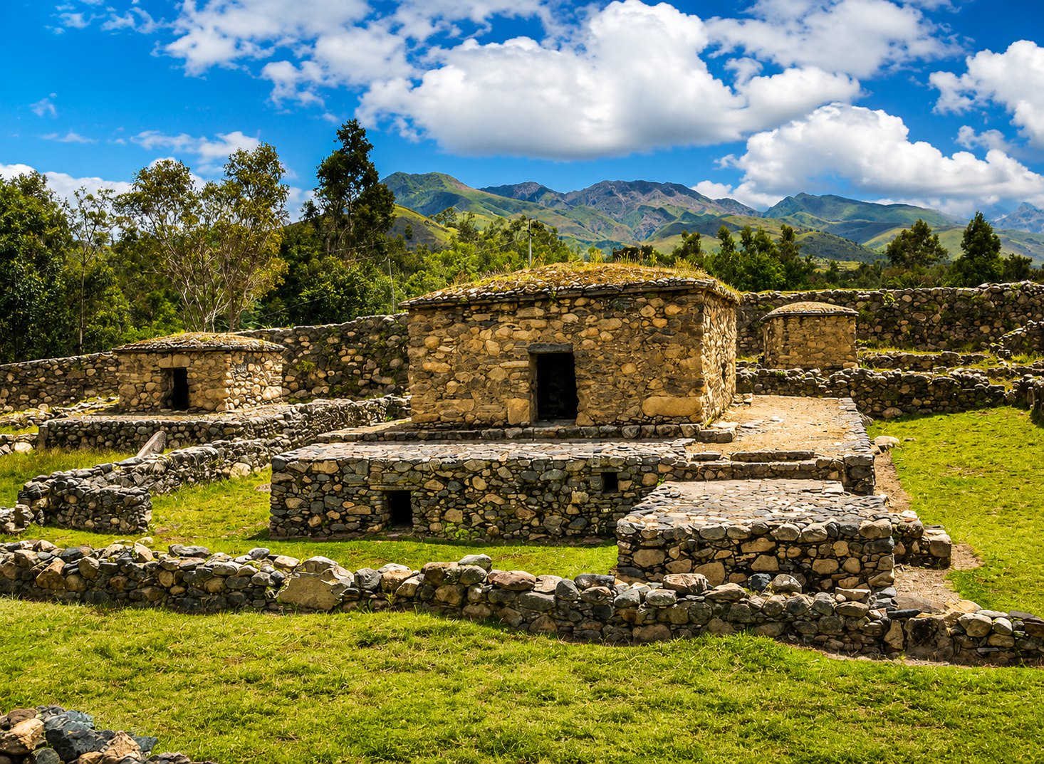 Stone funerary architecture at Willkawain with the Cordillera Negra in the background
